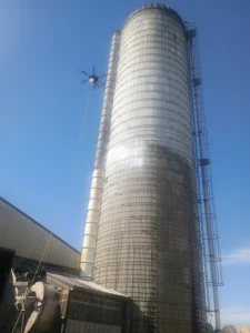 client photo of their silo being washed by Drone